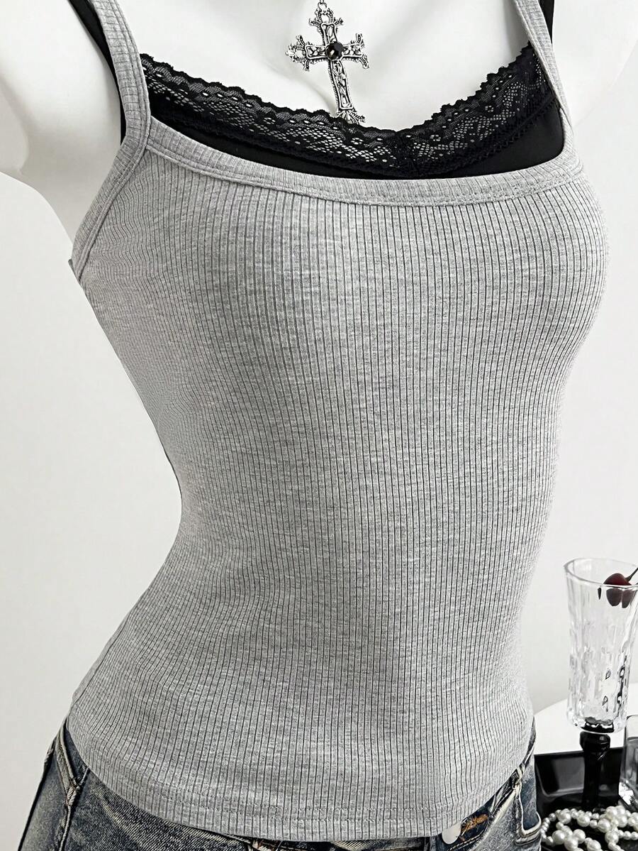 Women's slim fit spaghetti strap cami tank top with contrast lace trim along the neckline