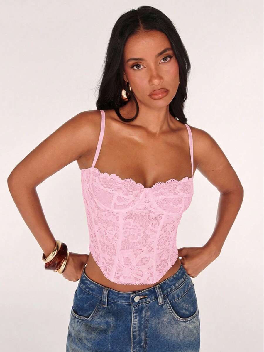 Women’s camisole top with cup detail, spaghetti straps, lined body, and slim fit design in knitted fabric with an asymmetrical hem.