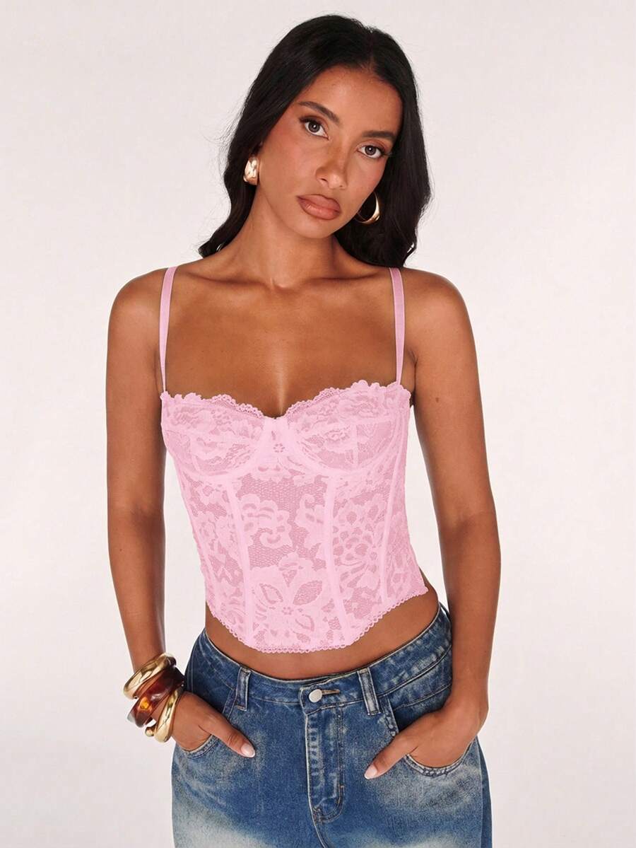 Black women’s lace cami top with spaghetti straps, contrast lace details, and an asymmetrical hem, styled as a slim-fit lined casual top.