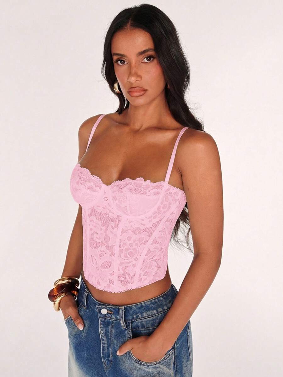 Black women’s lace cami top with spaghetti straps, contrast lace details, and an asymmetrical hem, styled as a slim-fit lined casual top.