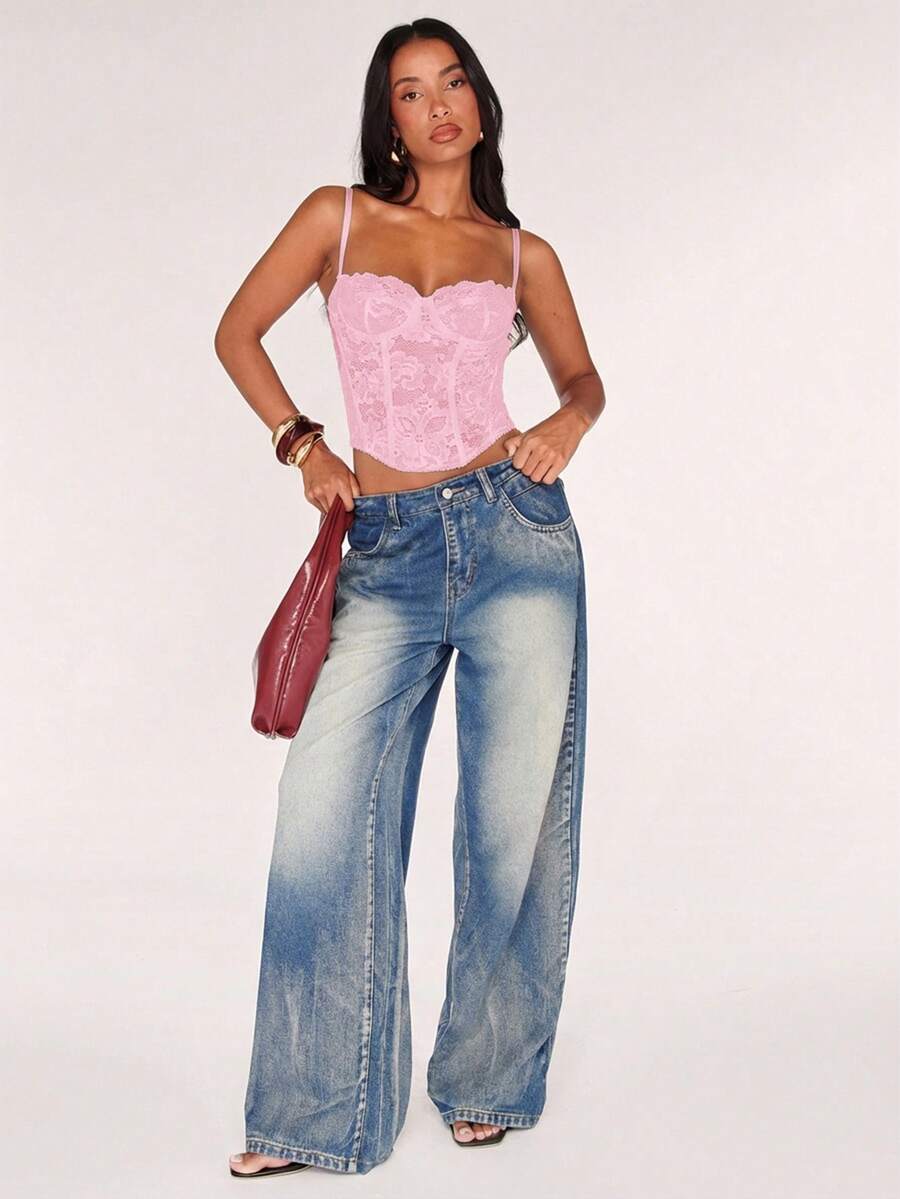 Women’s camisole top with cup detail, spaghetti straps, lined body, and slim fit design in knitted fabric with an asymmetrical hem.
