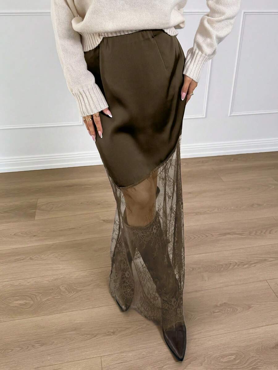 Women's army green lace patchwork maxi skirt with asymmetrical slit, low waist design, and semi-sheer mesh rib-knit details.
