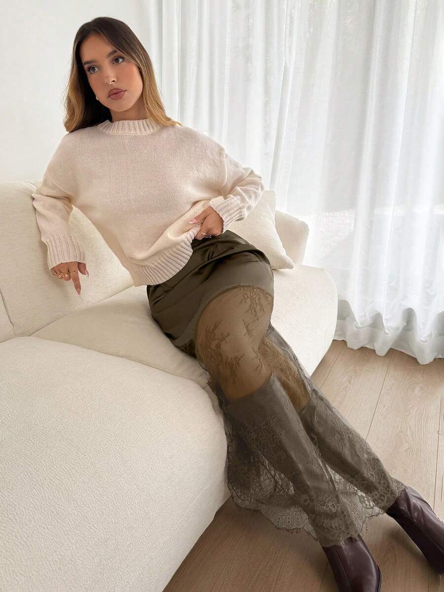 Women's army green lace patchwork maxi skirt with asymmetrical slit, low waist design, and semi-sheer mesh rib-knit details.
