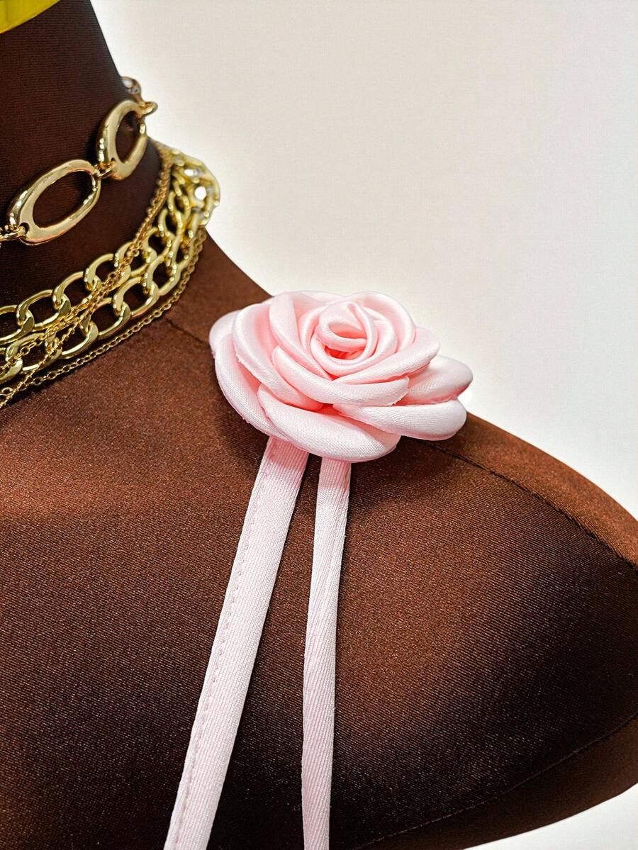 Women's bodycon mini dress featuring a 3D rose accent, thin spaghetti straps, and an open back design.