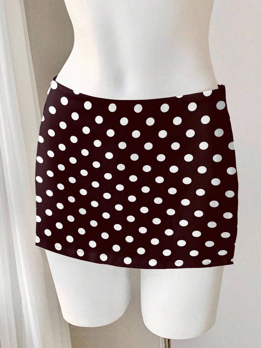 Women's white 100% cotton low waist mini skirt featuring a tropical print and zipper detail.
