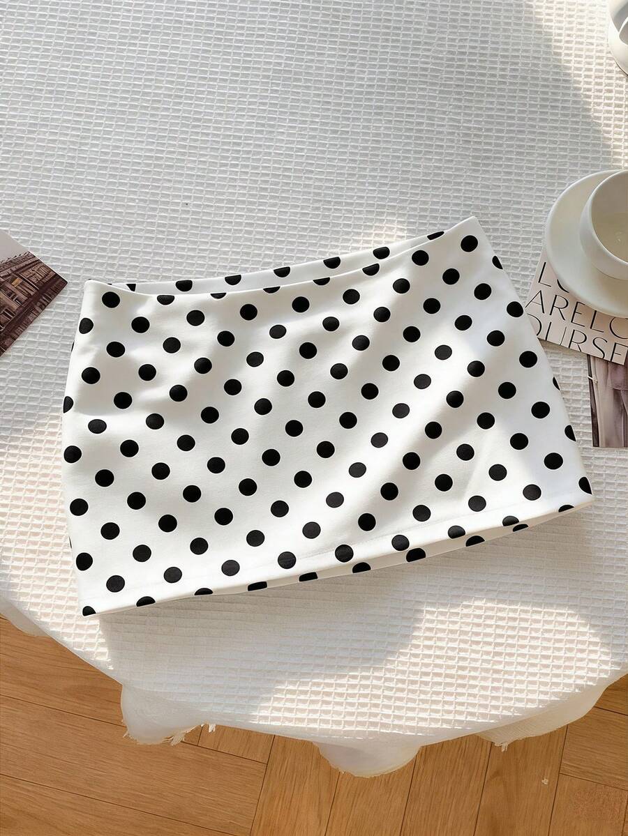 Women's white 100% cotton low waist mini skirt featuring a tropical print and zipper detail.