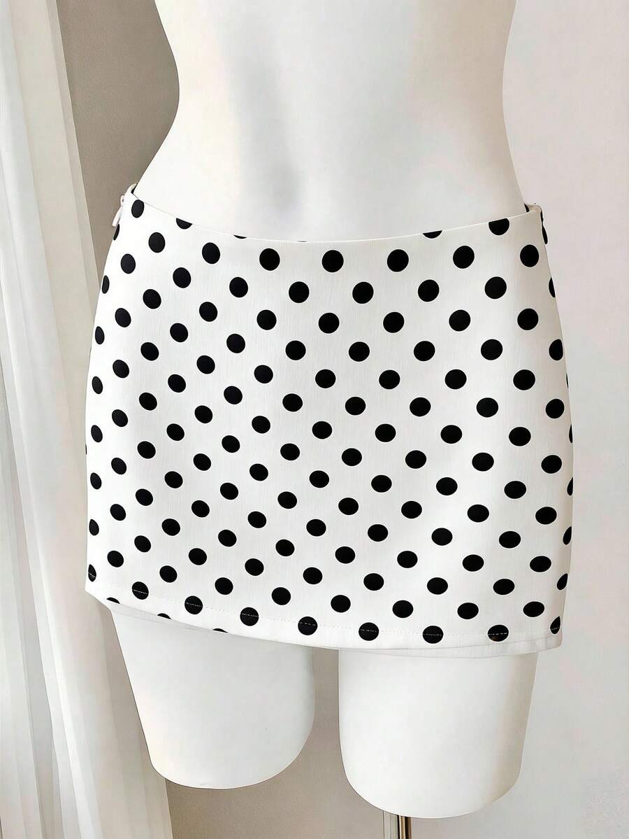 Women's white 100% cotton low waist mini skirt featuring a tropical print and zipper detail.