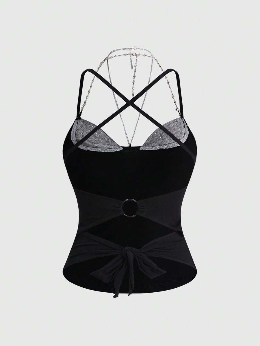 Women's black halter backless crop top with criss cross knot design and spaghetti straps.