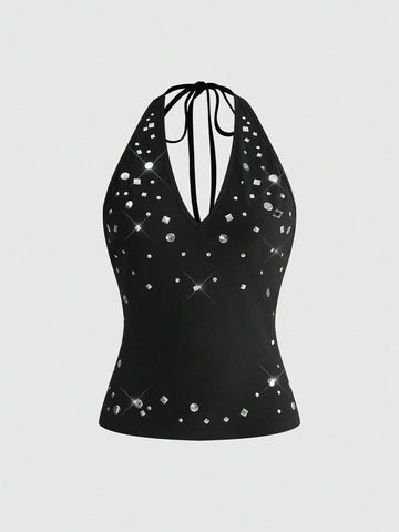 Women's black halter tank top featuring a lace-up tie-back design and slim fit cut.