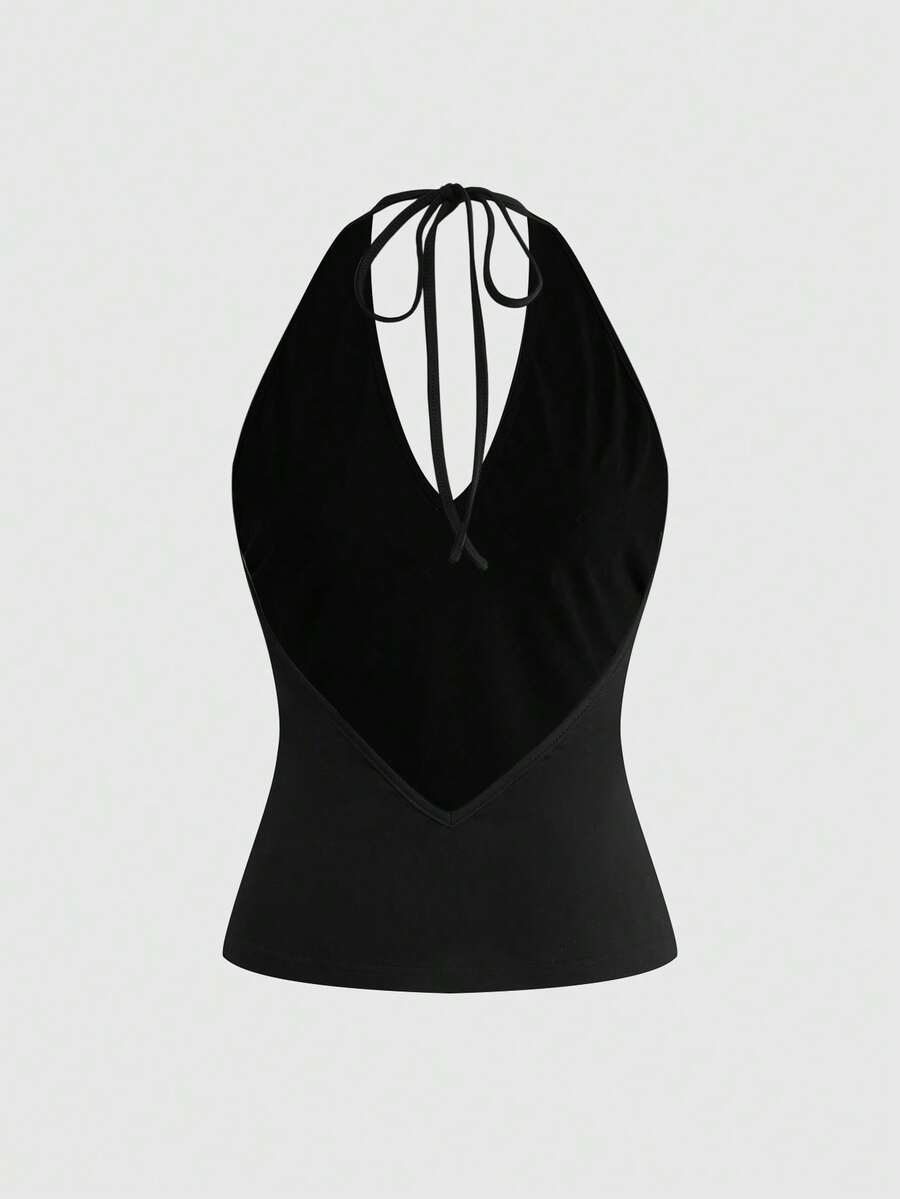 Women's black halter tank top featuring a lace-up tie-back design and slim fit cut.
