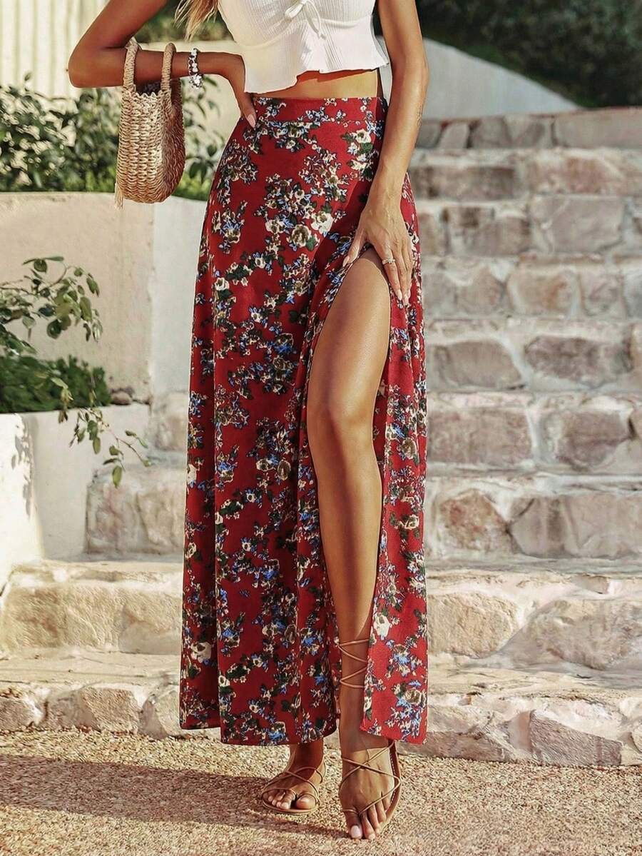 Women's black boho ditsy floral print maxi skirt featuring a high waist and a stylish split thigh slit detail.