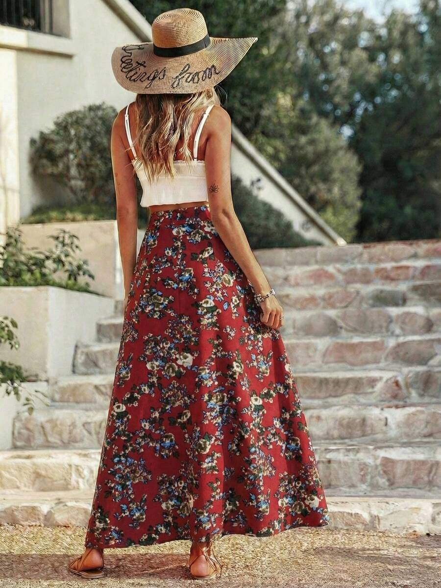 Women's black boho ditsy floral print maxi skirt featuring a high waist and a stylish split thigh slit detail.