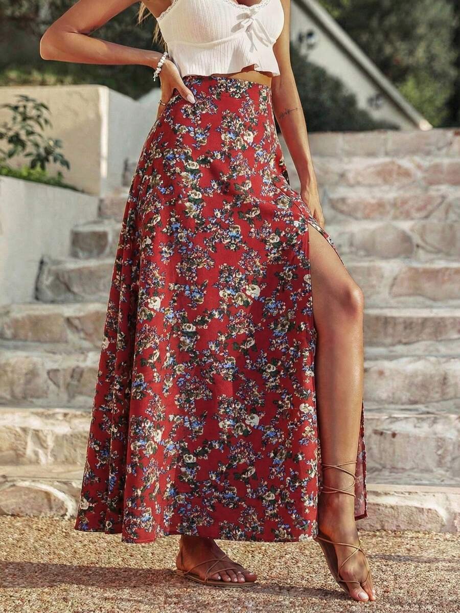 Women's black boho ditsy floral print maxi skirt featuring a high waist and a stylish split thigh slit detail.