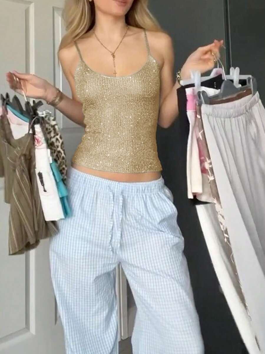 Grey rib-knit camisole top featuring a V-neckline and thin spaghetti straps for women.