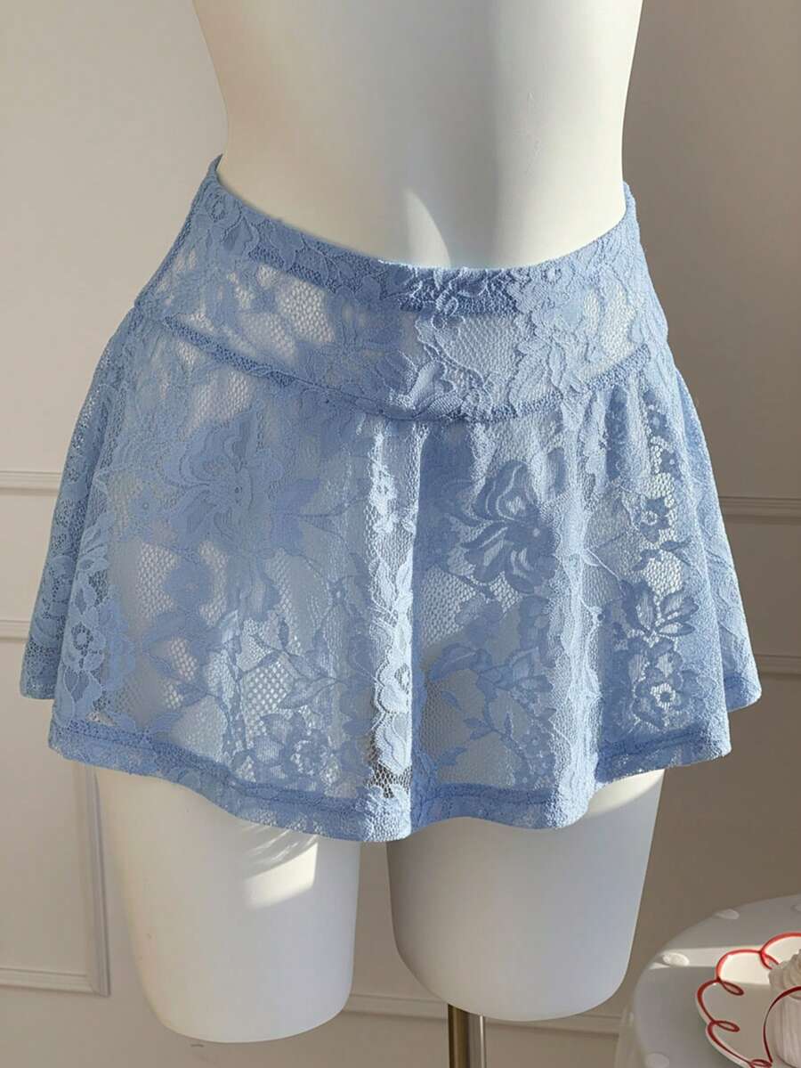 Women's black semi-sheer knitted lace mini skirt featuring a flared ruffle hem and low waist design