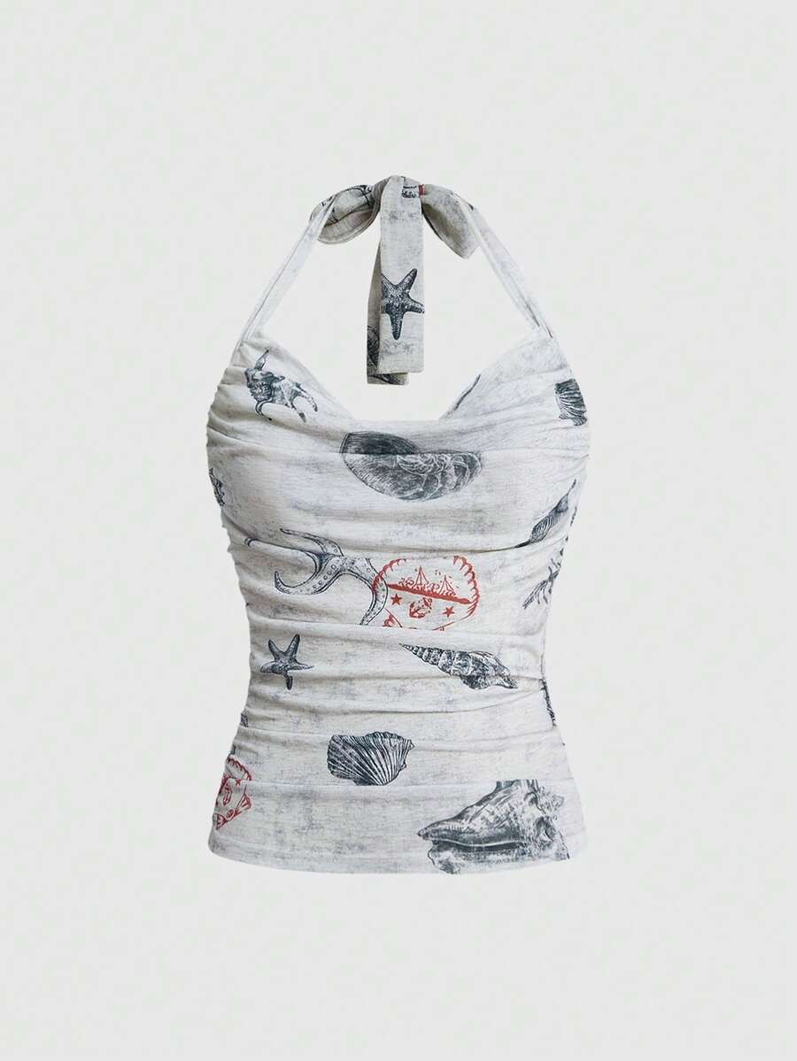 Blue halter cami tank top for women featuring an ocean fish and starfish print, spaghetti straps, slim fit knitted fabric, and a backless lace-up tie design.