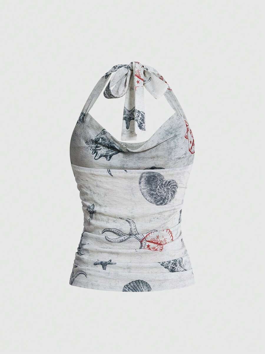Blue halter cami tank top for women featuring an ocean fish and starfish print, spaghetti straps, slim fit knitted fabric, and a backless lace-up tie design.