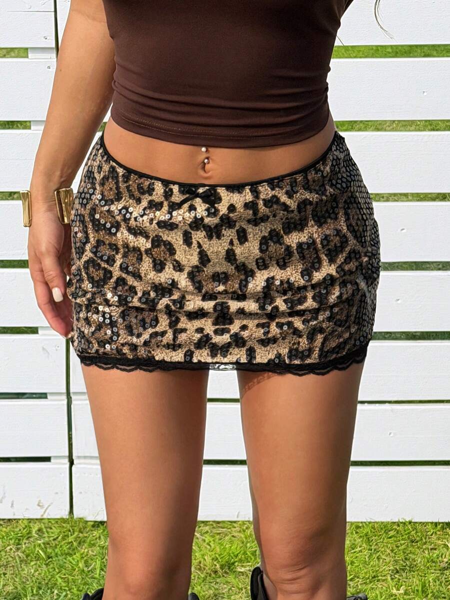 Women's black sequin bodycon mini skirt with low waist and zipper detail for party night out