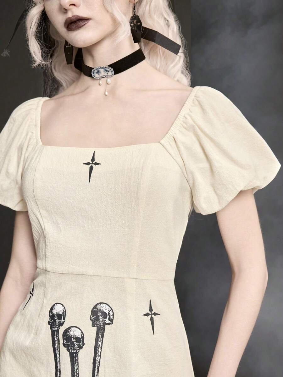 White Goth mini skater dress for women featuring dark skull graphic print, square neckline, short puff sleeves, and lace-up detail.