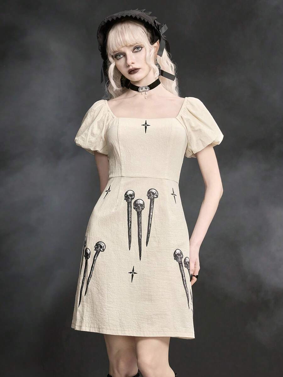 White Goth mini skater dress for women featuring dark skull graphic print, square neckline, short puff sleeves, and lace-up detail.