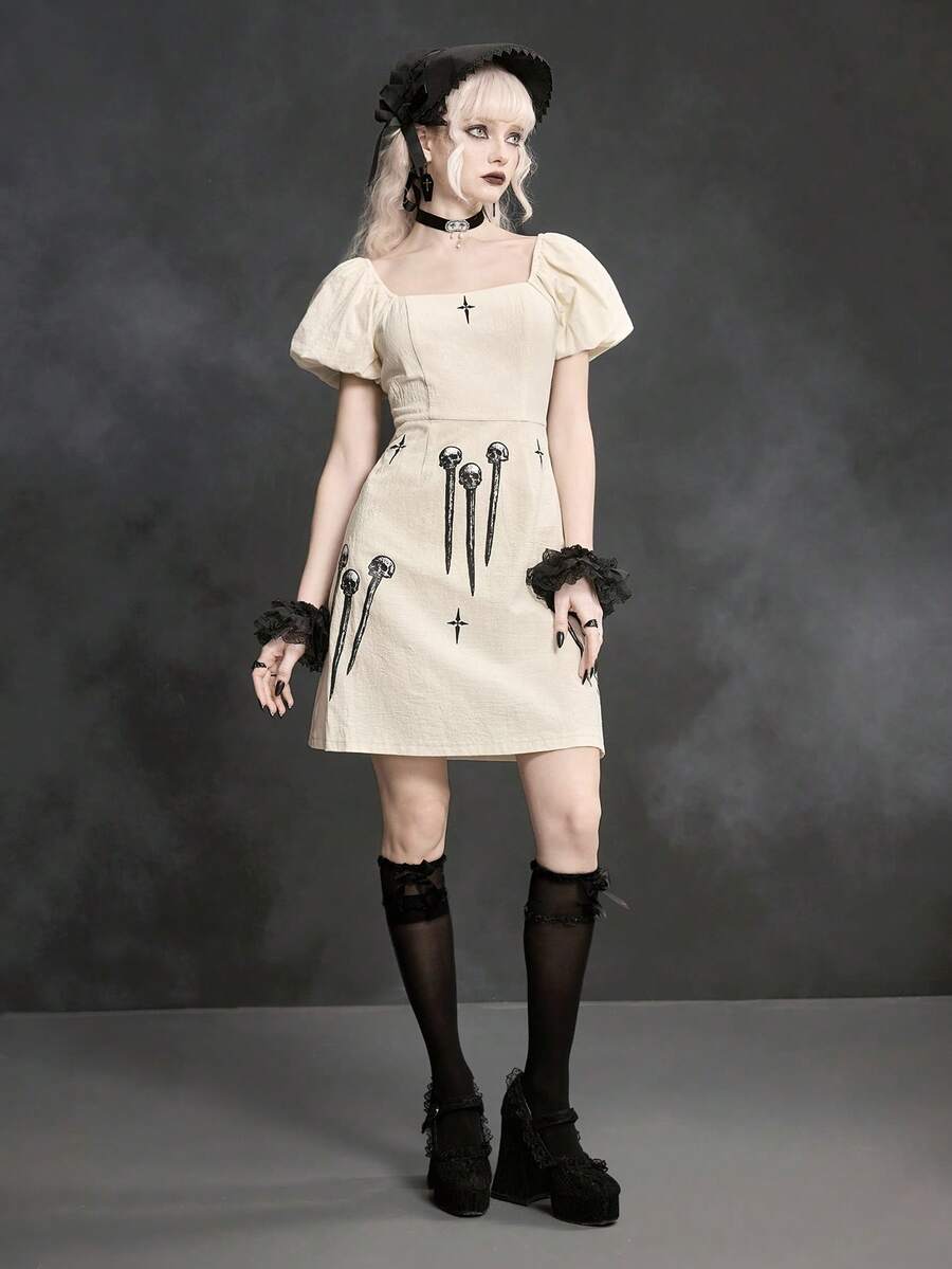 White Goth mini skater dress for women featuring dark skull graphic print, square neckline, short puff sleeves, and lace-up detail.
