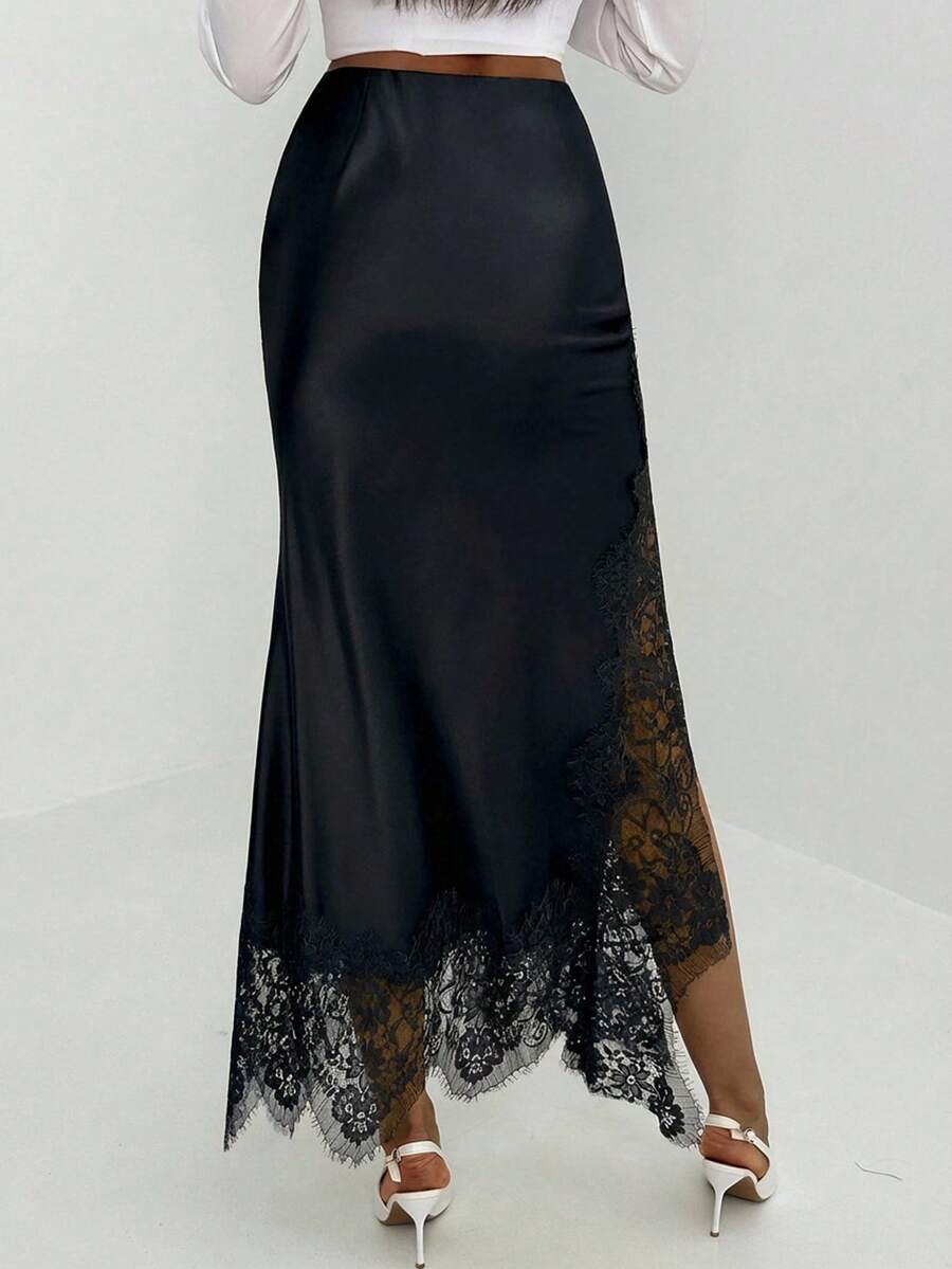 Women's elegant black lace patchwork mermaid maxi skirt featuring asymmetrical contrast lace design and low waist fit.