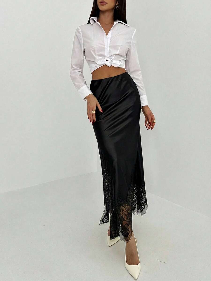 Women's elegant black lace patchwork mermaid maxi skirt featuring asymmetrical contrast lace design and low waist fit.