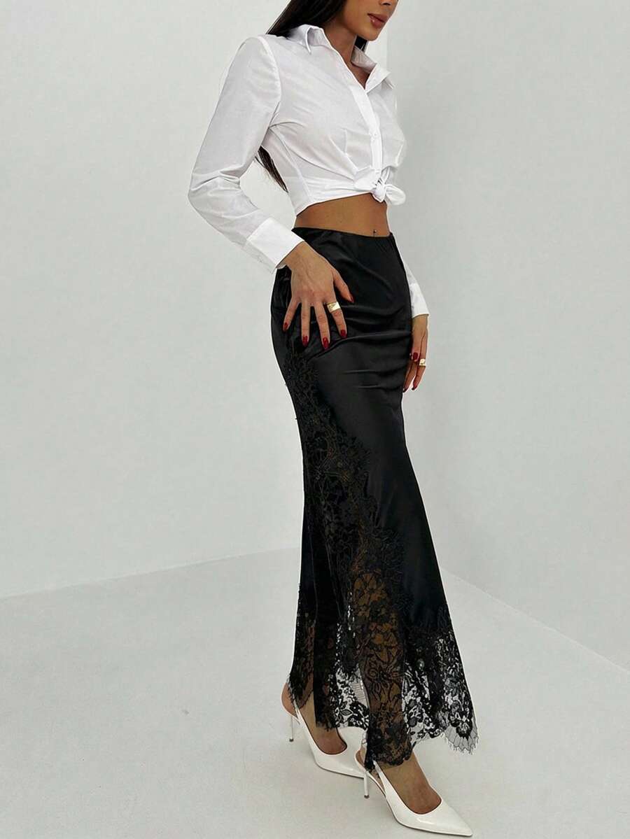 Women's elegant black lace patchwork mermaid maxi skirt featuring asymmetrical contrast lace design and low waist fit.