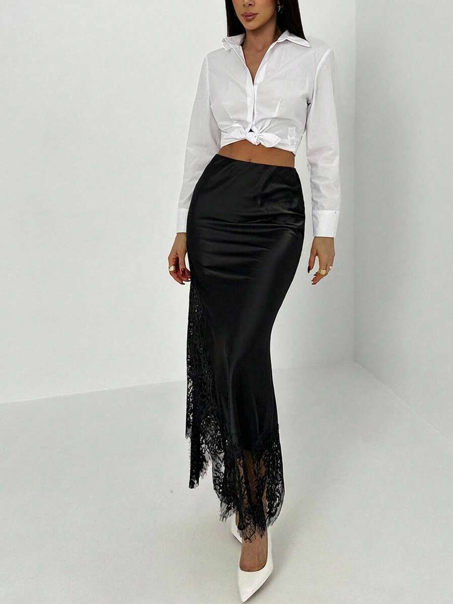 Women's elegant black lace patchwork mermaid maxi skirt featuring asymmetrical contrast lace design and low waist fit.