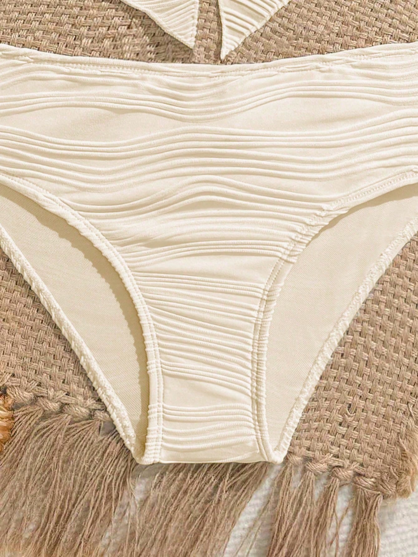 Tween girls two-piece tankini swimwear set with spaghetti straps, asymmetrical design, and 3D rose detail. Features a plant-pattern top and mid-waist bottoms in stretchy fabric for beach or pool wear.