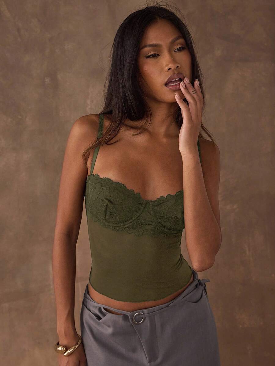 Women's black contrast lace camisole with spaghetti straps, cup detail, semi-sheer finish, and slim fit for going out or date night.