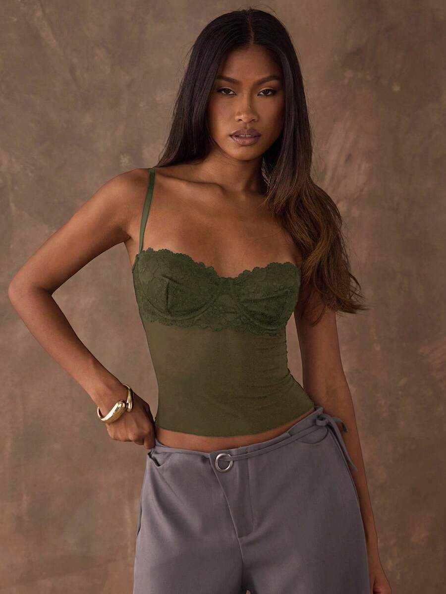 Women's black contrast lace camisole with spaghetti straps, cup detail, semi-sheer finish, and slim fit for going out or date night.