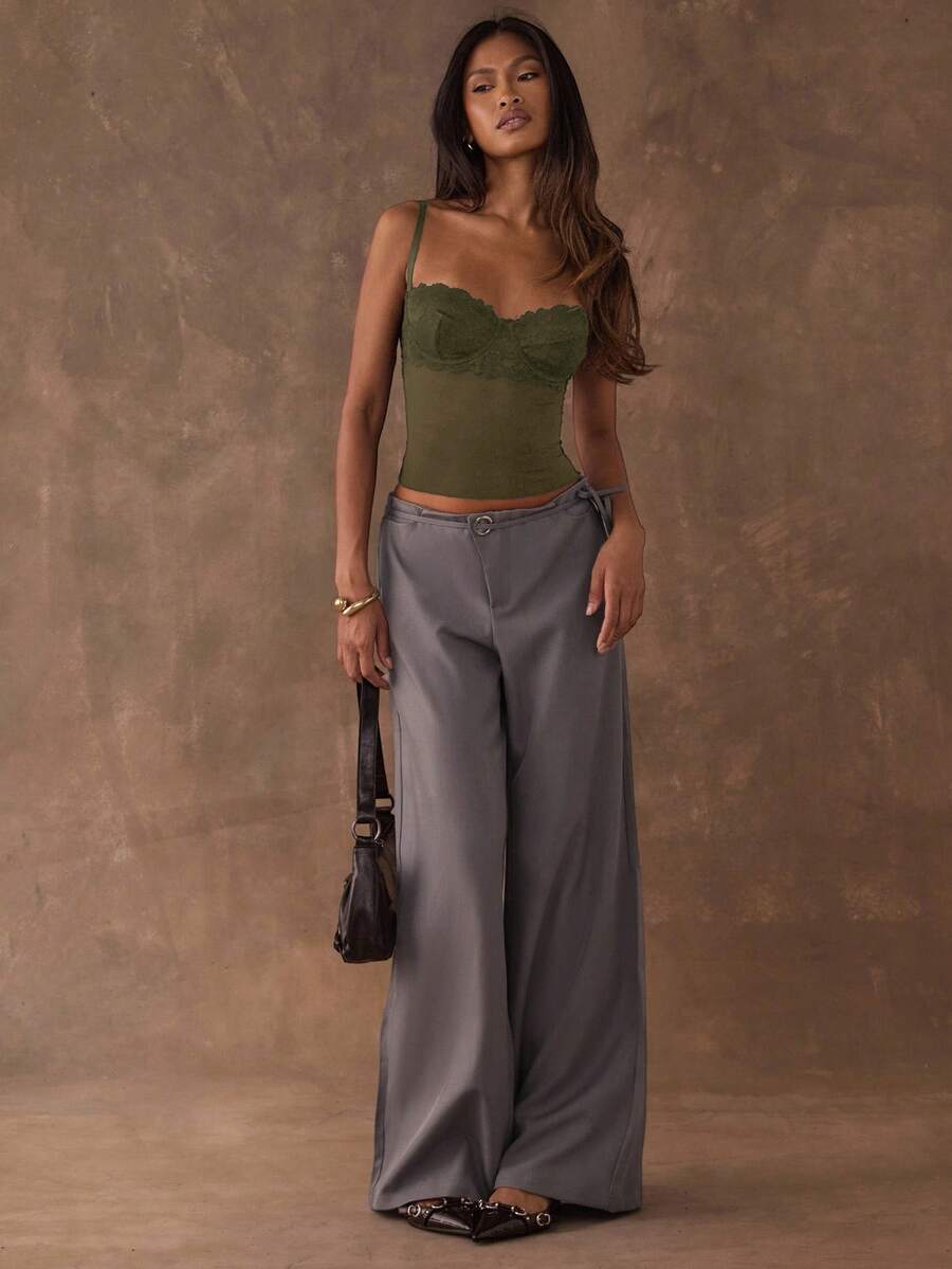 Women's black contrast lace camisole with spaghetti straps, cup detail, semi-sheer finish, and slim fit for going out or date night.