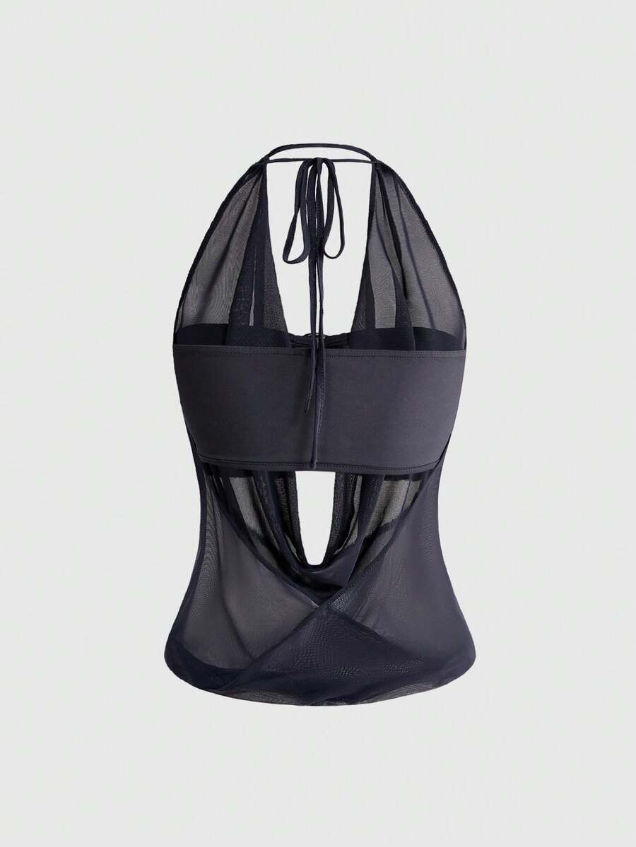 Women's cowl neck halter crop tank top featuring a draped backless design and matching bandeau inner layer.