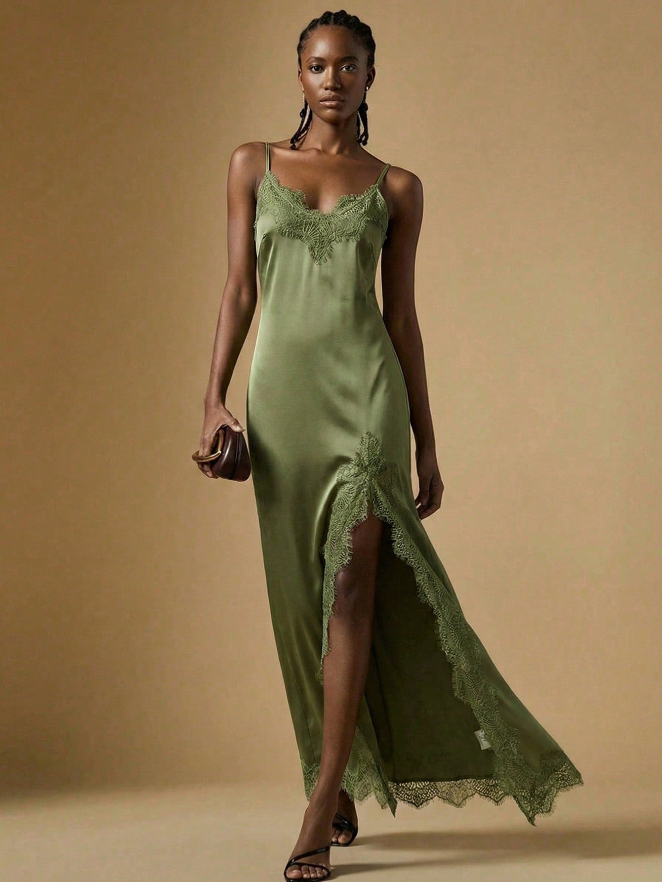Women's black lace split satin long dress featuring spaghetti straps, asymmetrical slit hem, and matching arm sleeves.