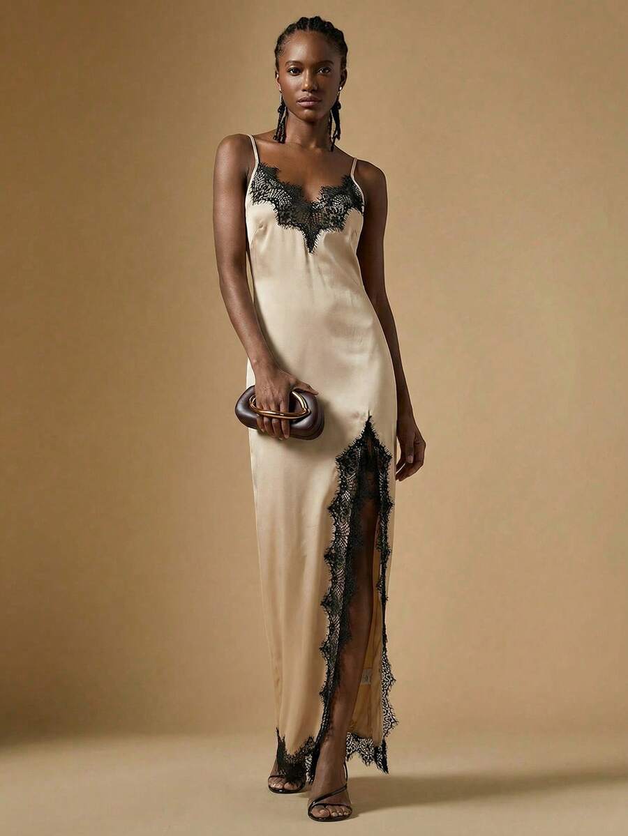 Women's black lace split satin long dress featuring spaghetti straps, asymmetrical slit hem, and matching arm sleeves.