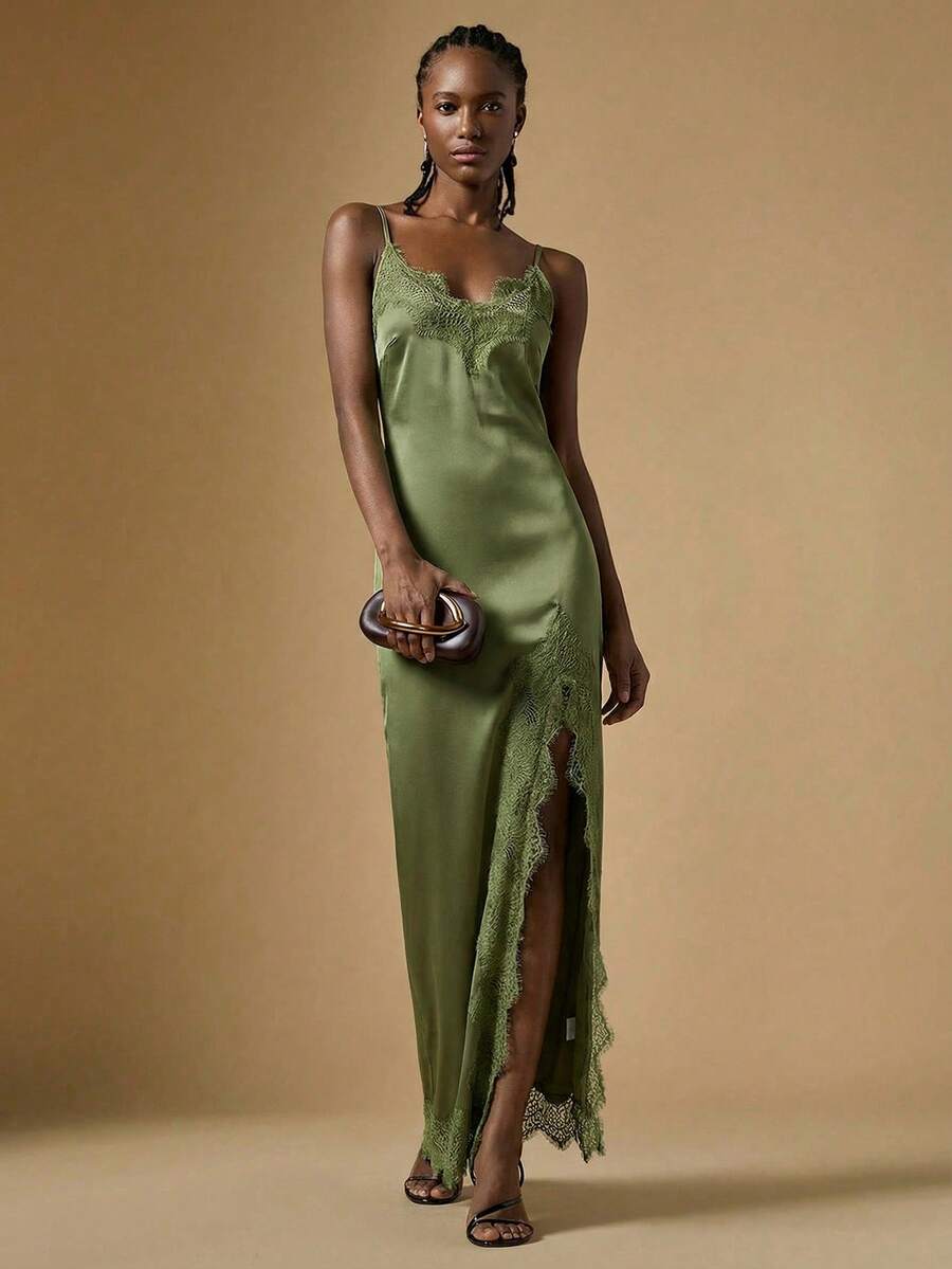 Women's black lace split satin long dress featuring spaghetti straps, asymmetrical slit hem, and matching arm sleeves.