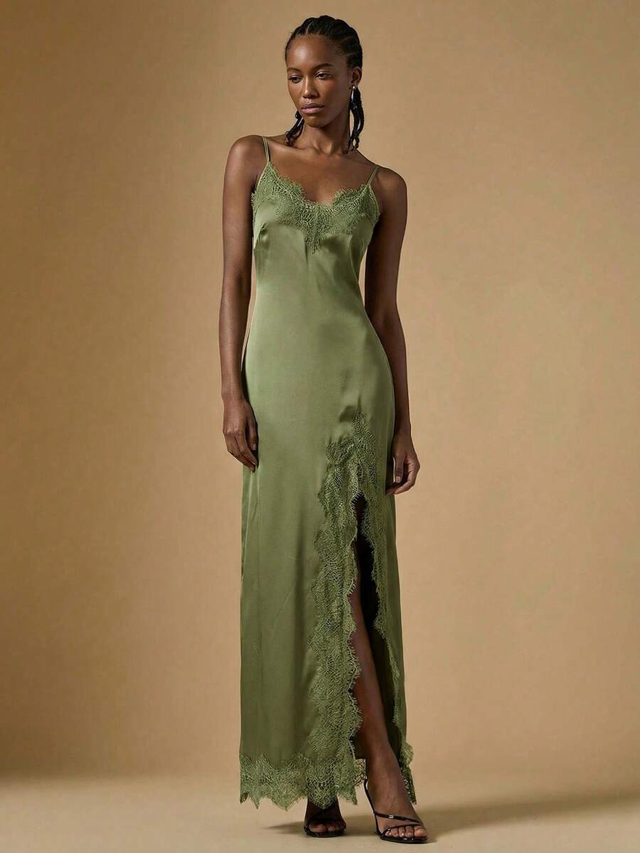 Women's black lace split satin long dress featuring spaghetti straps, asymmetrical slit hem, and matching arm sleeves.
