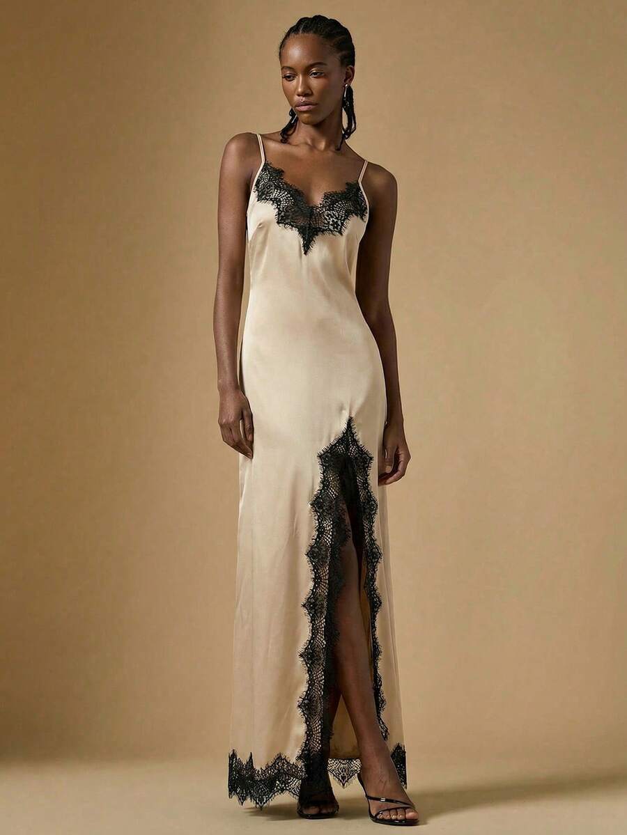 Women's black lace split satin long dress featuring spaghetti straps, asymmetrical slit hem, and matching arm sleeves.
