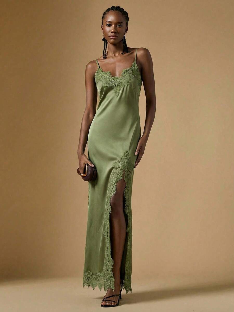 Women's black lace split satin long dress featuring spaghetti straps, asymmetrical slit hem, and matching arm sleeves.