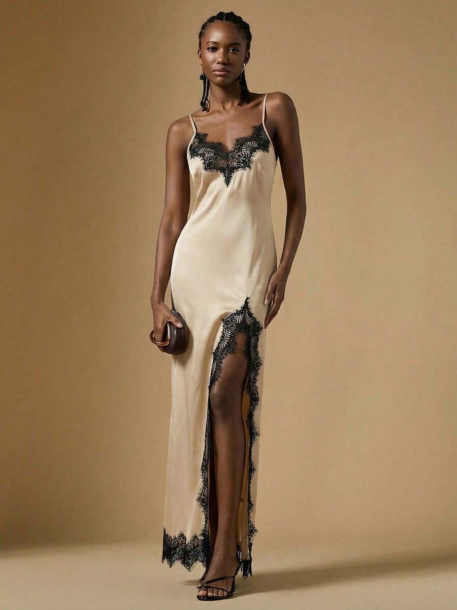 Women's black lace split satin long dress featuring spaghetti straps, asymmetrical slit hem, and matching arm sleeves.