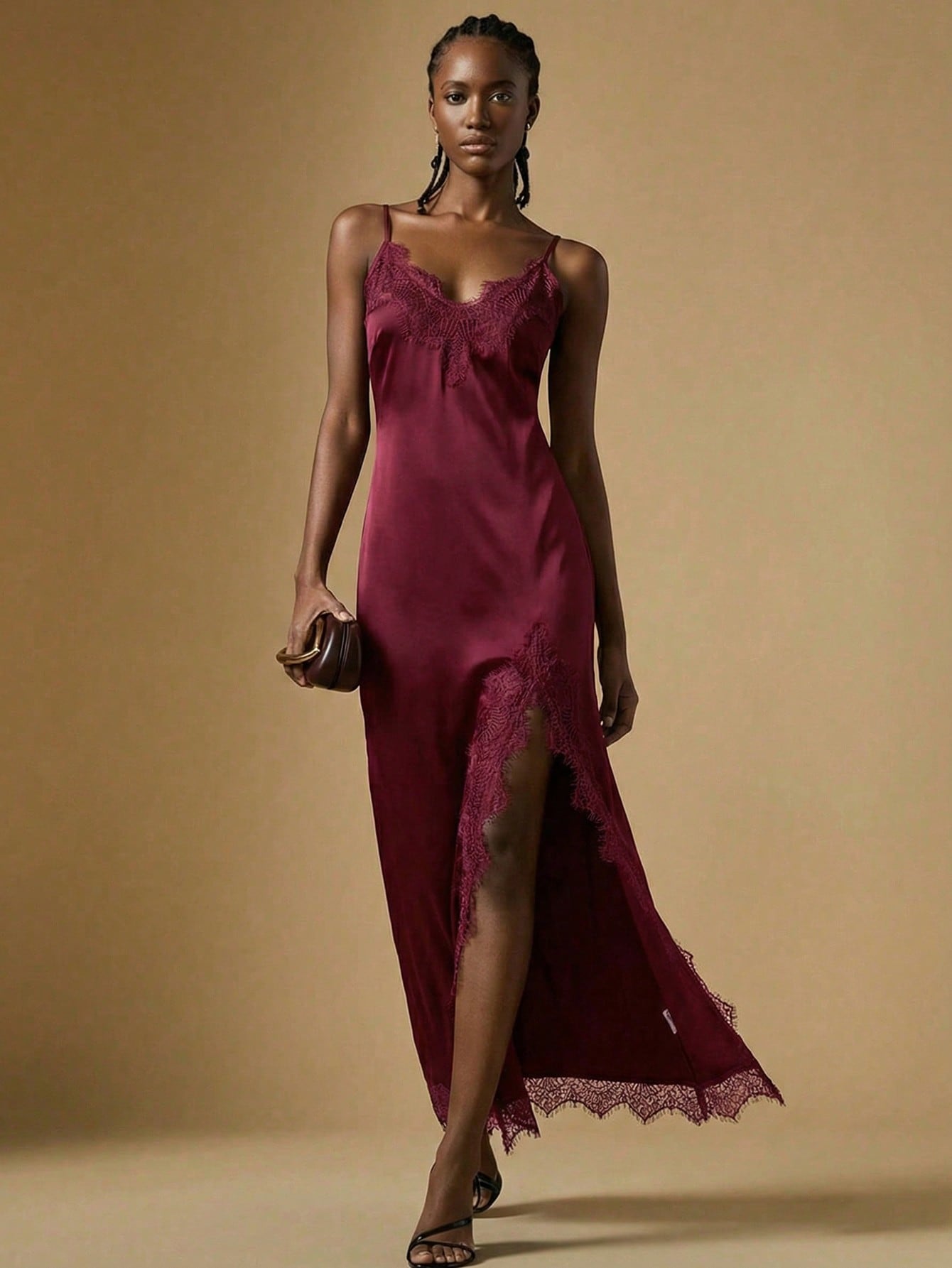 Women's black lace split satin long dress featuring spaghetti straps, asymmetrical slit hem, and matching arm sleeves.