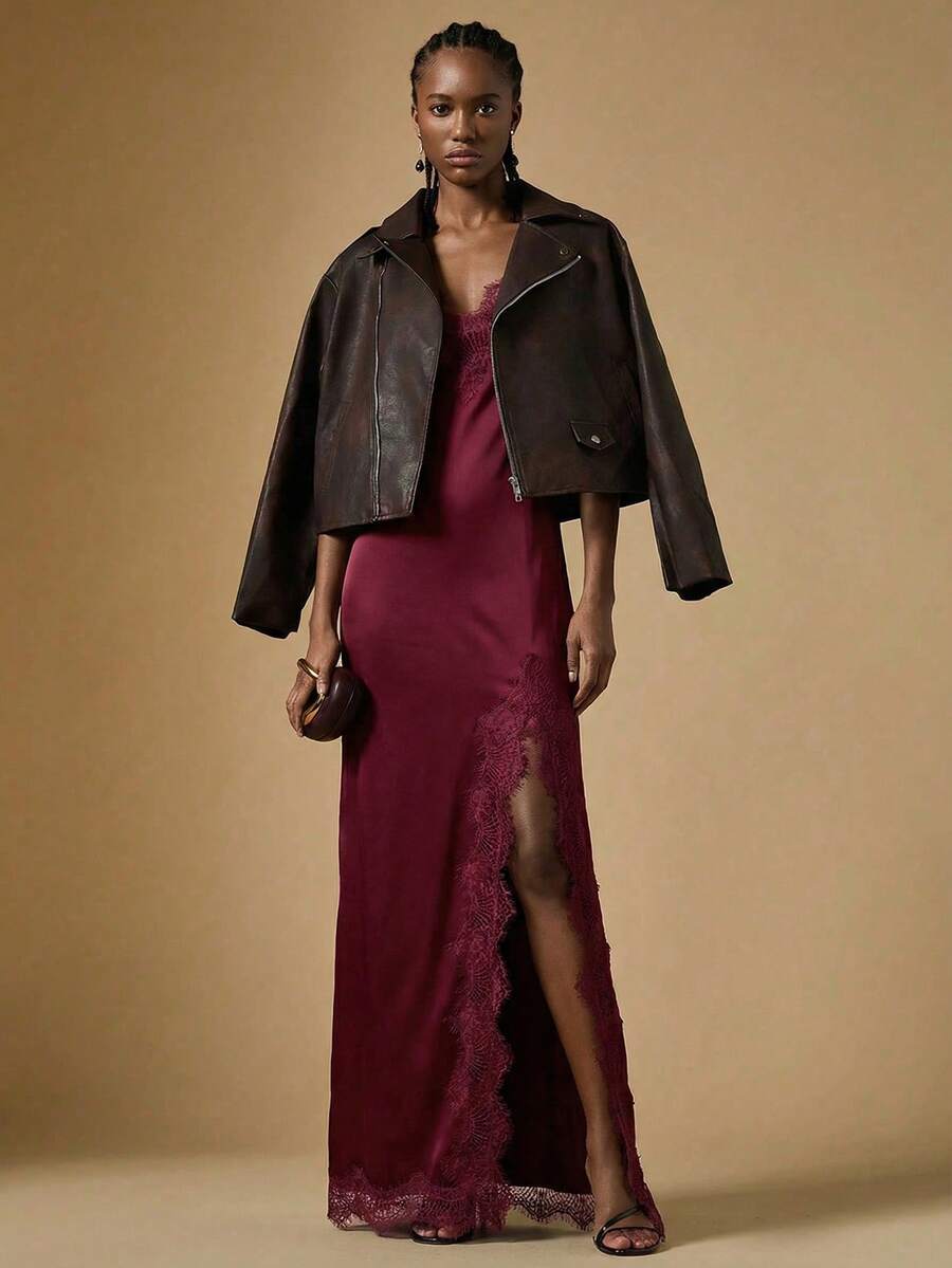 Women's black lace split satin long dress featuring spaghetti straps, asymmetrical slit hem, and matching arm sleeves.