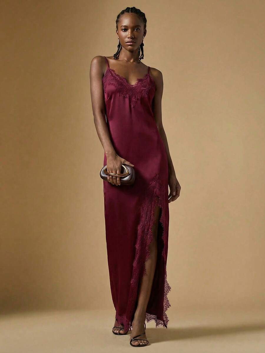Women's black lace split satin long dress featuring spaghetti straps, asymmetrical slit hem, and matching arm sleeves.