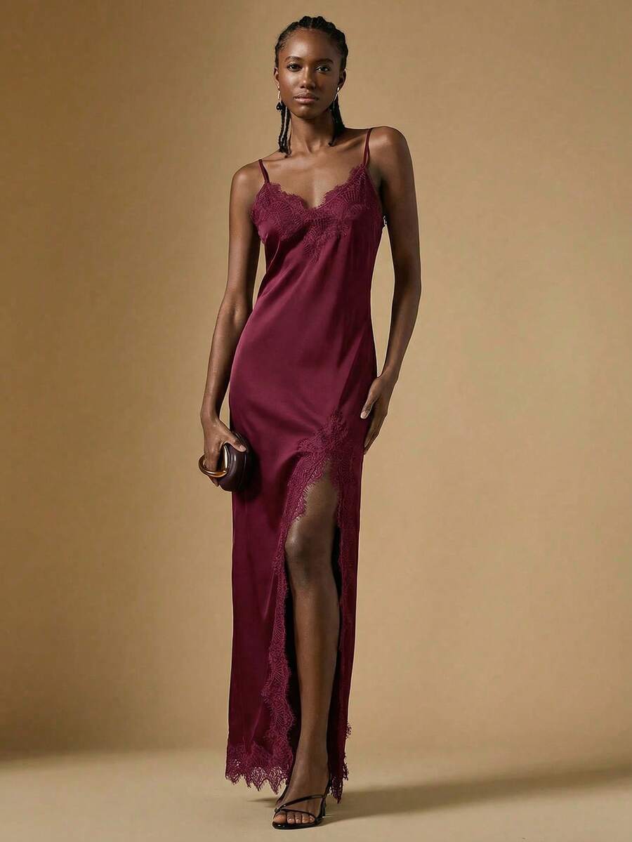 Women's black lace split satin long dress featuring spaghetti straps, asymmetrical slit hem, and matching arm sleeves.