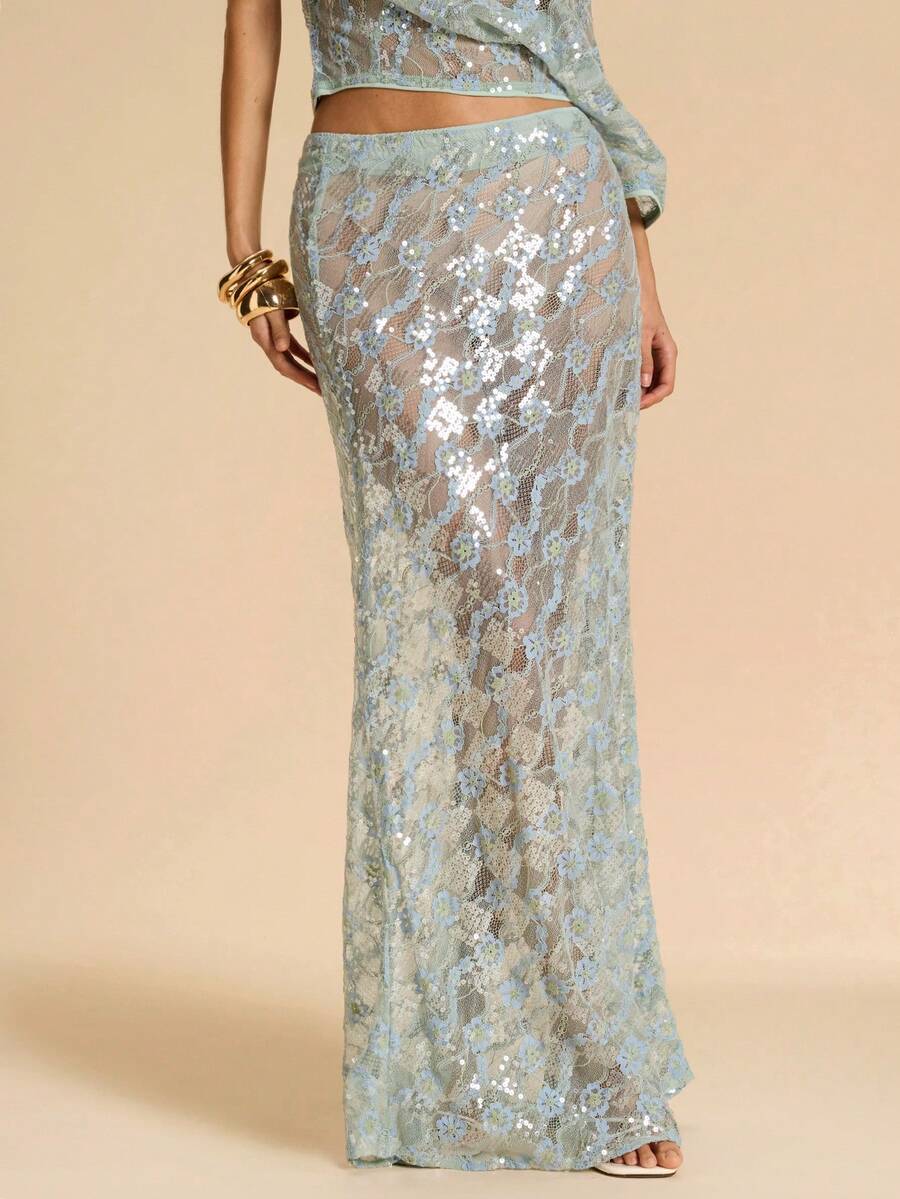 Black low waist extra long mermaid maxi skirt with asymmetrical zipper detail and side slit.