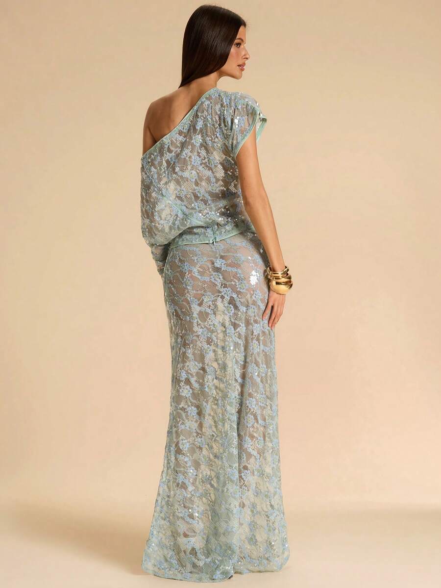 Black low waist extra long mermaid maxi skirt with asymmetrical zipper detail and side slit.