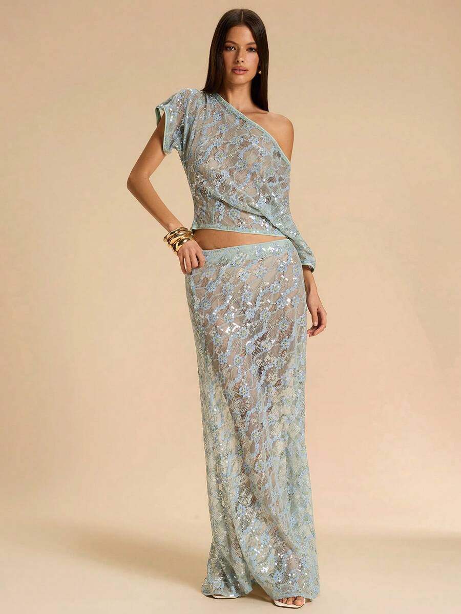 Black low waist extra long mermaid maxi skirt with asymmetrical zipper detail and side slit.