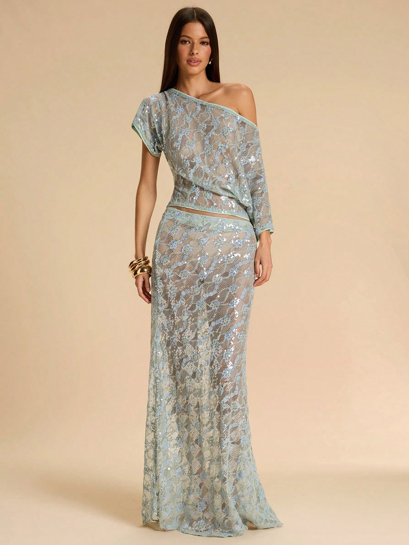 Black low waist extra long mermaid maxi skirt with asymmetrical zipper detail and side slit.