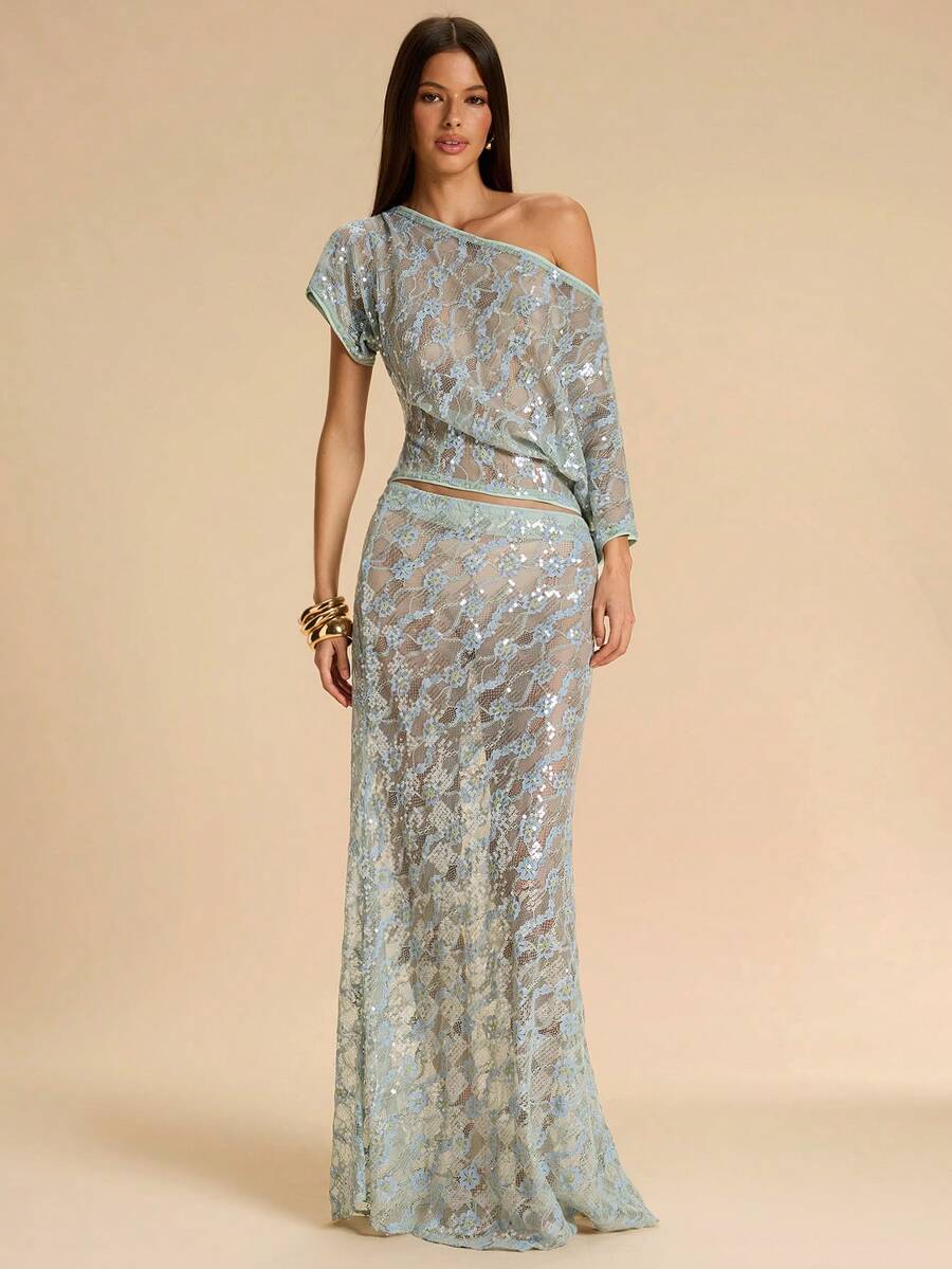 Black low waist extra long mermaid maxi skirt with asymmetrical zipper detail and side slit.